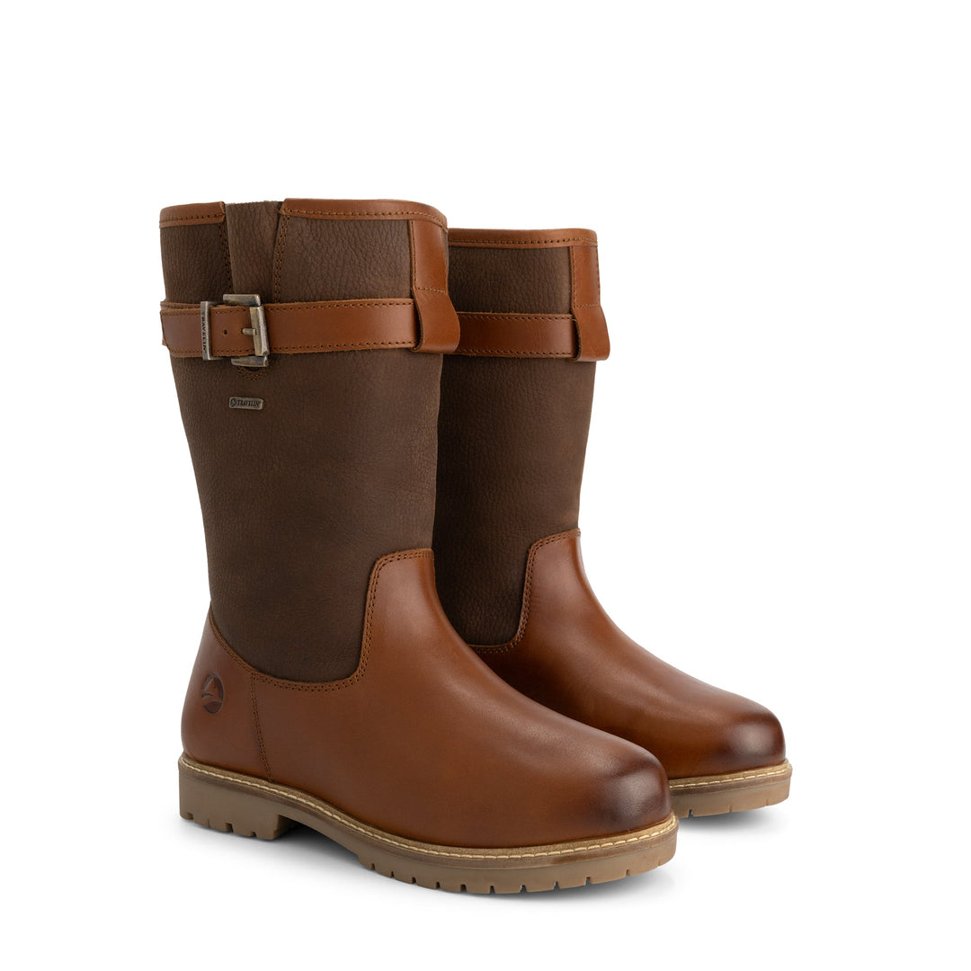 Brown tall boots with buckle straps, rounded toes and low heels