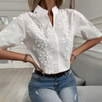 White women's blouse with floral embroidery and short sleeves