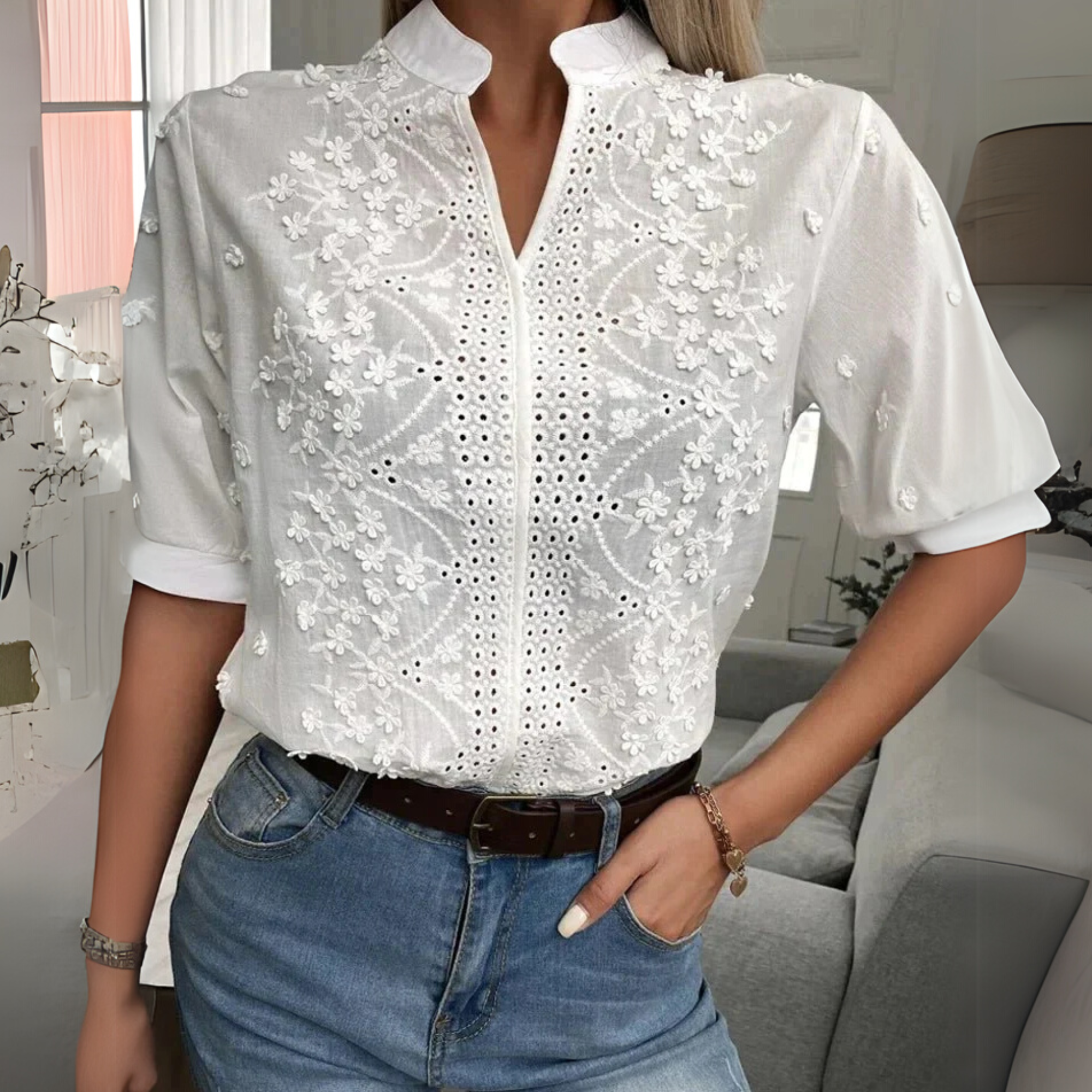 White women's blouse with floral embroidery and short sleeves