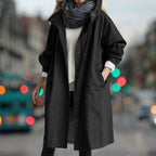Women's longline hooded rain coat with button front and side pockets
