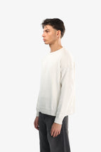 Men's off-white crew neck knit sweater with long sleeves
