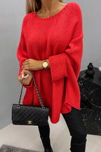 Women's loose knit poncho sweater with crew neckline and wide sleeves