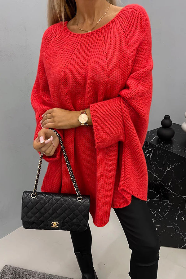Women's loose knit poncho sweater with crew neckline and wide sleeves
