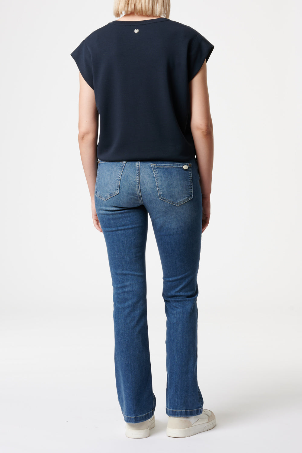 Women's blue bootcut jeans with mid-rise waist