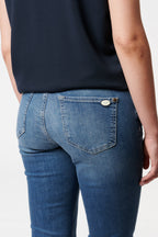 Women's blue bootcut jeans with mid-rise waist