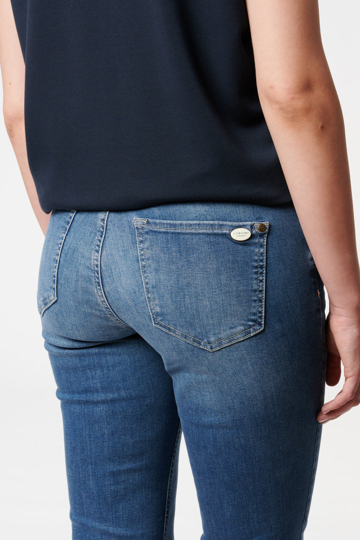 Women's blue bootcut jeans with mid-rise waist