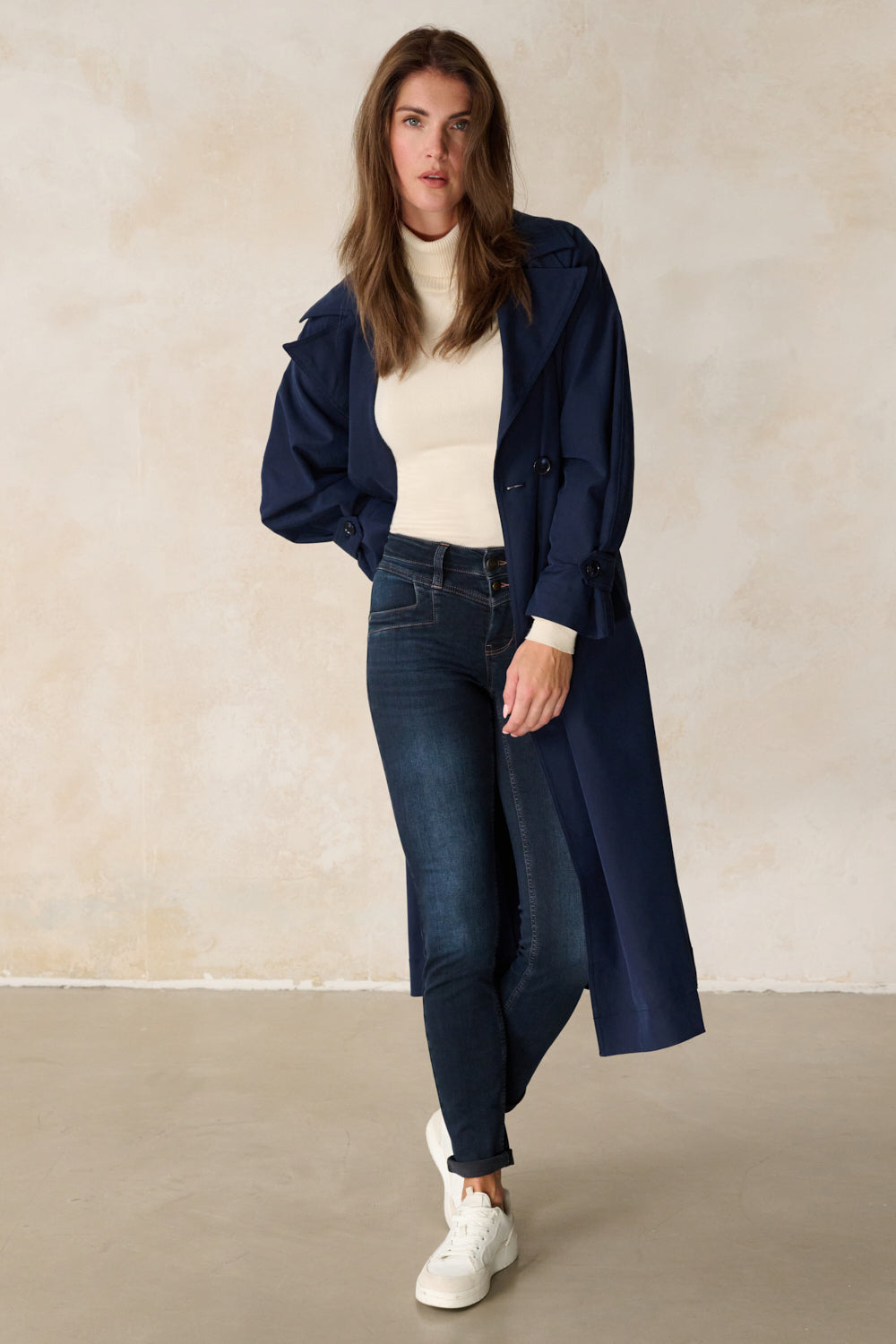 Women's dark blue slim fit jeans with cuffed hems