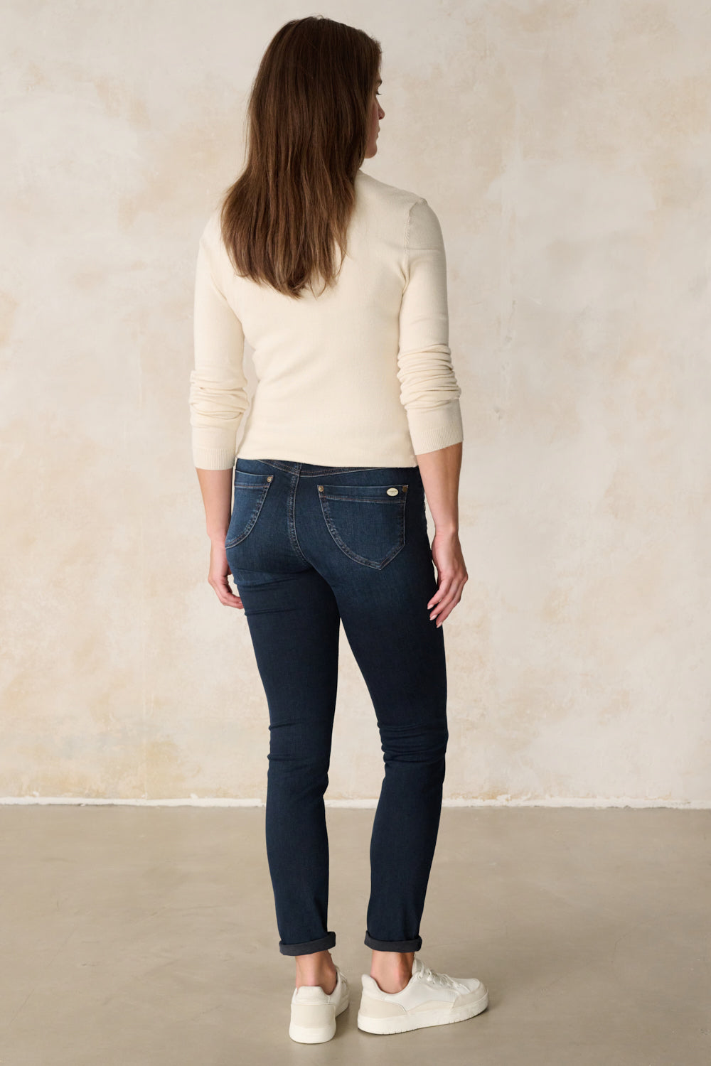 Women's dark blue slim fit jeans with cuffed hems