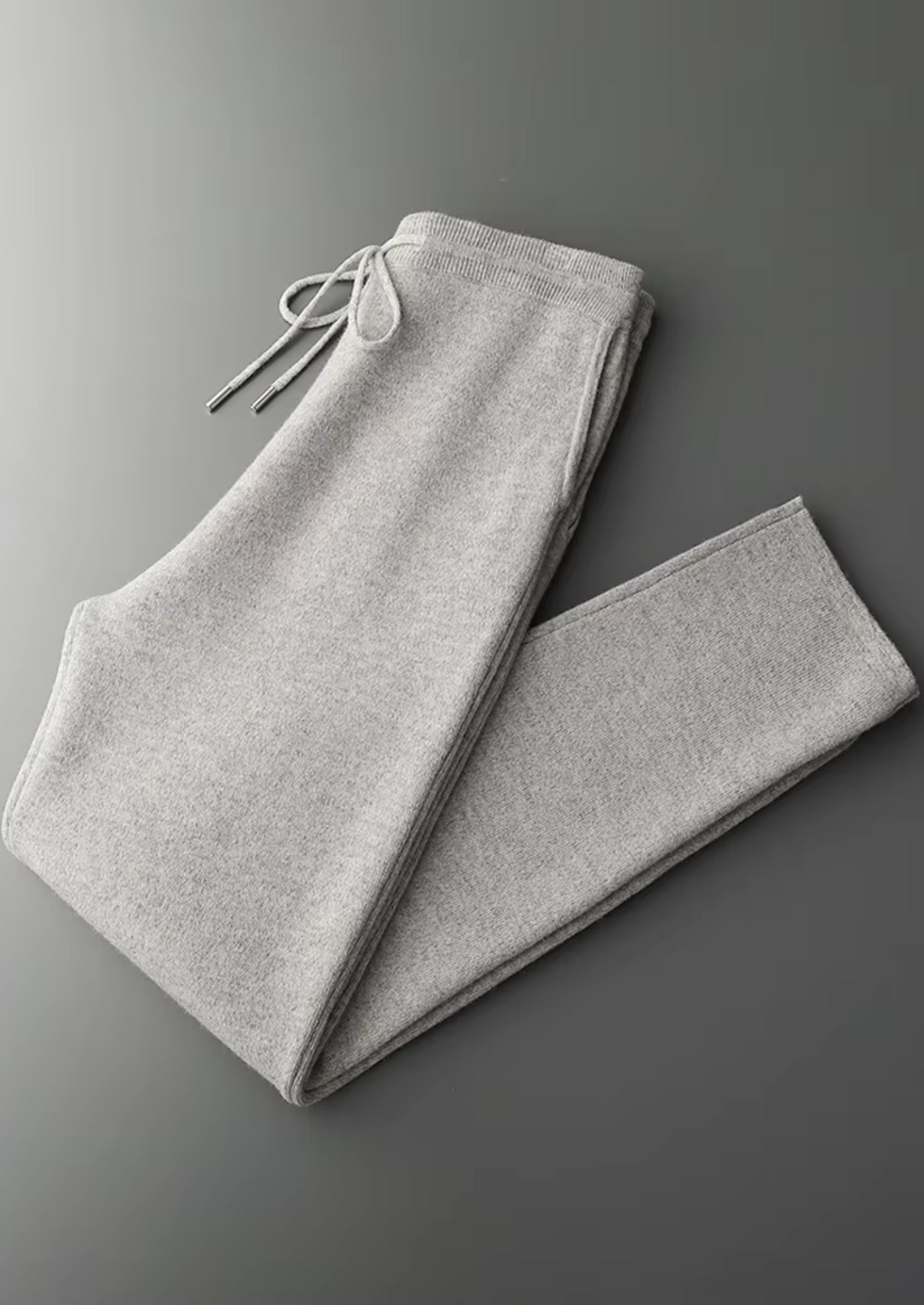 Men's two-tone grey knit tracksuit set with a zip jacket and drawstring trousers