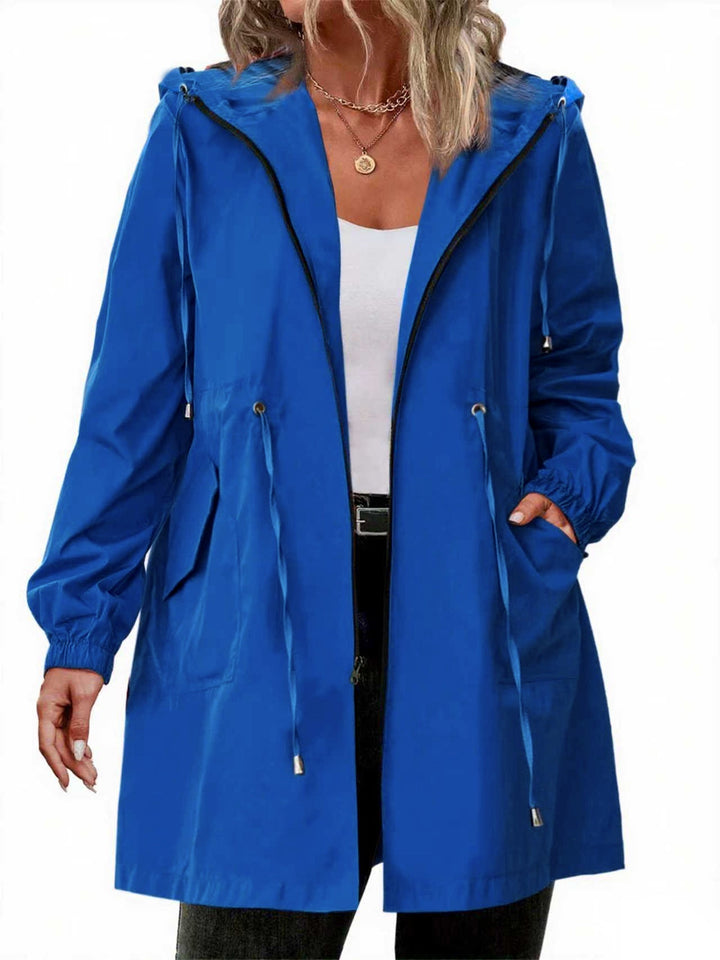 Women's longline hooded raincoat with zip front and drawstring waist