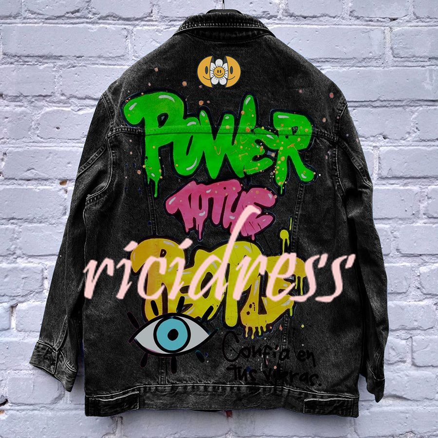 Graphic denim jacket with colourful Halloween-style artwork on the back