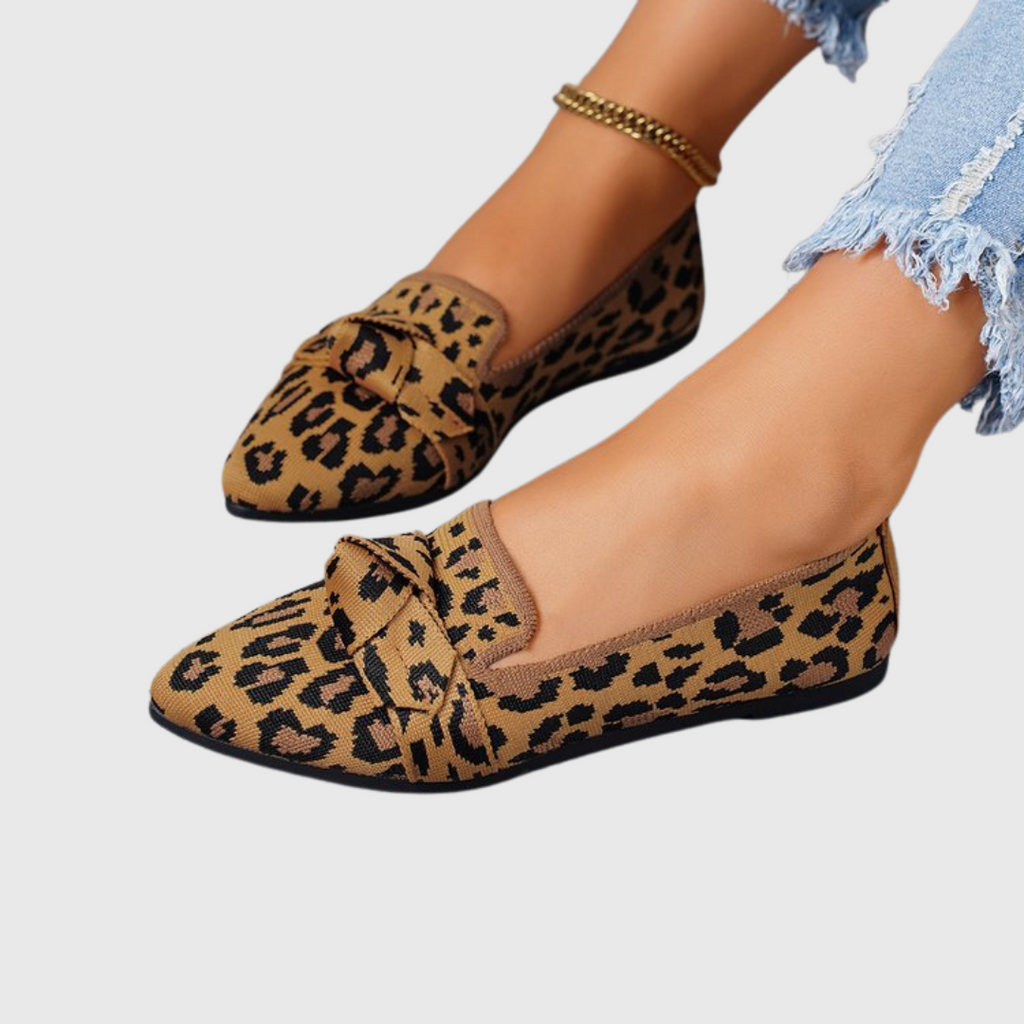 Women's leopard print loafers with pointed toes and bow details
