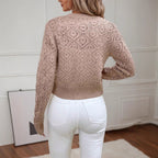 Women's cropped openwork knit cardigan with geometric pattern and button front