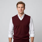 Men's sleeveless V-neck jumper layered over a collared shirt