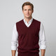 Men's sleeveless V-neck jumper layered over a collared shirt
