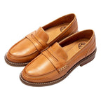 Men's penny loafers with rounded toes, stitched trim and low heels