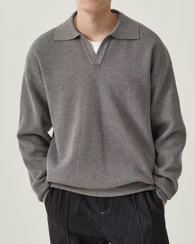 Men's textured knit polo sweater with open V-neck collar and long sleeves