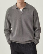 Men's textured knit polo sweater with open V-neck collar and long sleeves