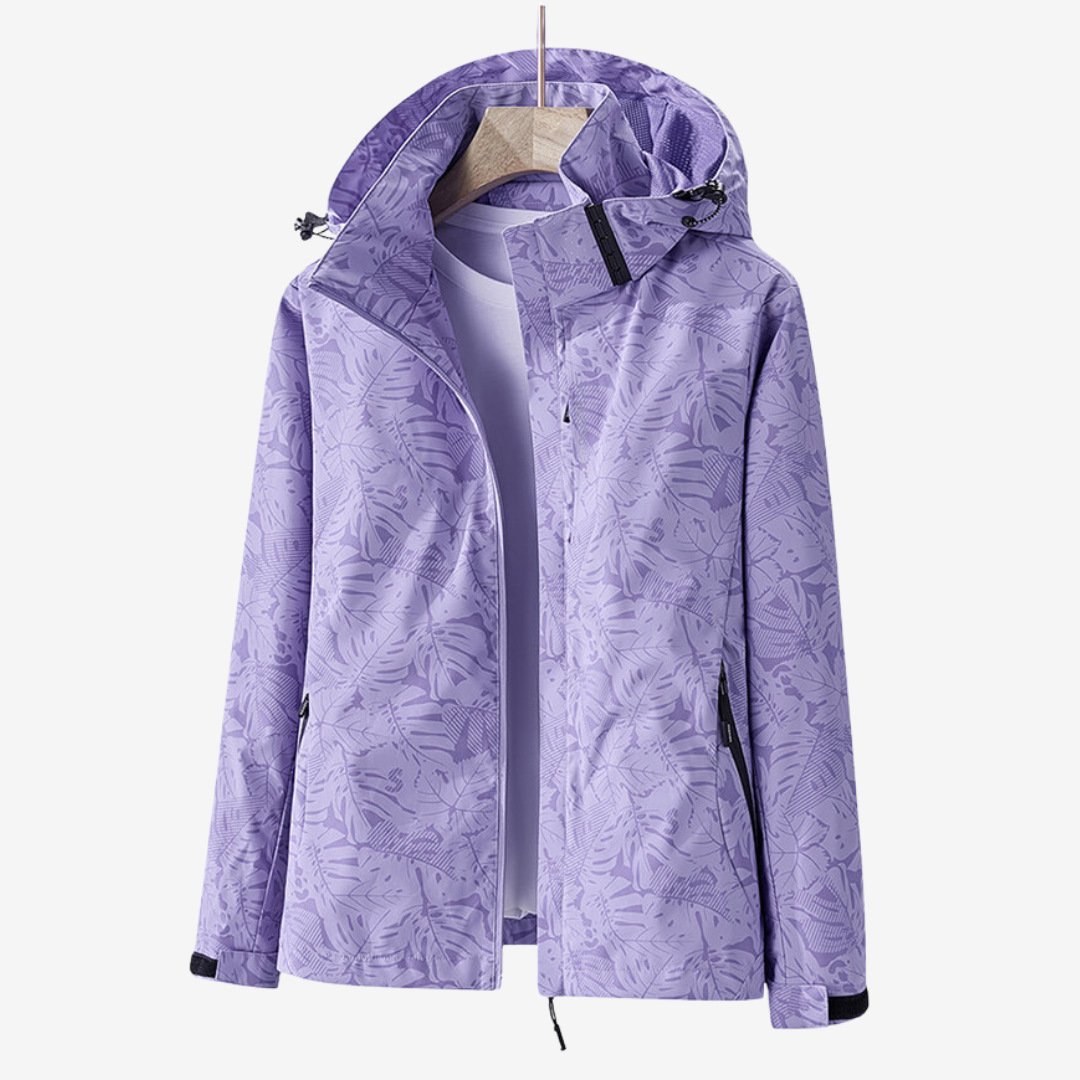 Women's hooded leaf print windbreaker jacket with long sleeves and zipped pockets