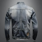 Men's blue-grey washed denim jacket with stand collar, long sleeves and zipped pockets