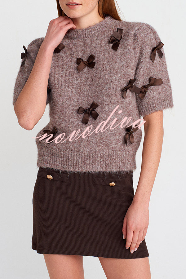 Women's brown knit crop top with dark bow details and short sleeves