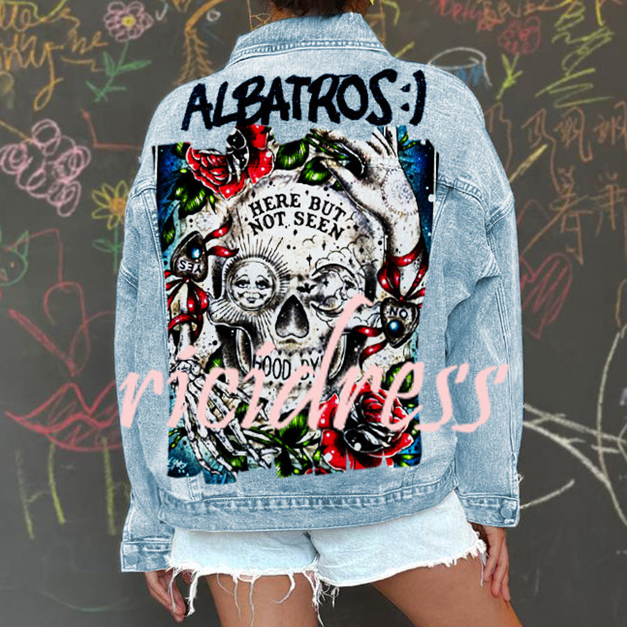 Women's light blue denim jacket with Halloween skull and rose graphic on the back
