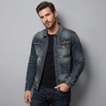 Men's faded blue denim jacket with long sleeves, zip front and chest pockets