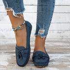 Women's tassel loafers with stitched edging and flat soles