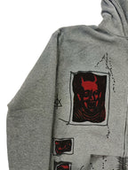 Men's grey zip-up hoodie with hood, graphic patches and front pockets