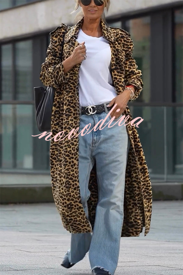 Woman wearing a leopard print long sleeve midi trench coat