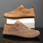 Knit sneakers with lace-up fronts, round toes and pull tabs