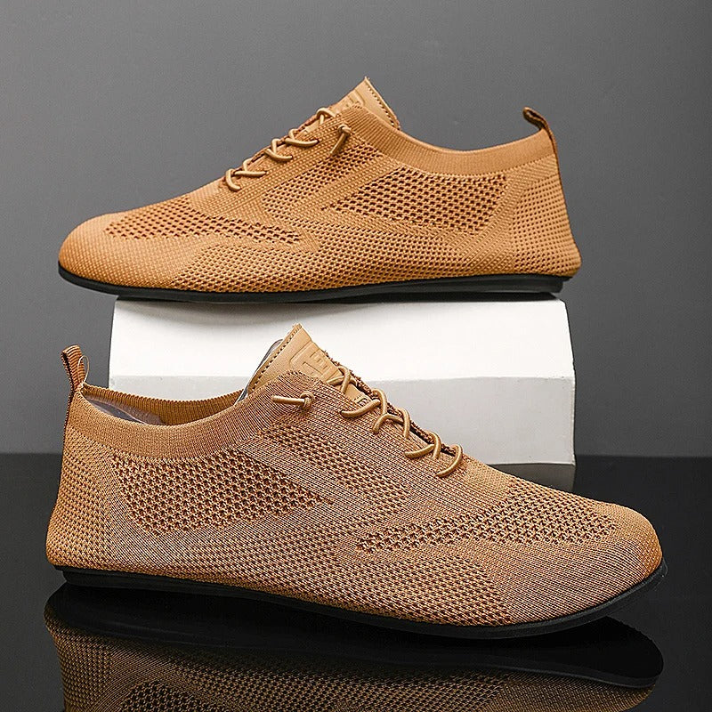 Knit sneakers with lace-up fronts, round toes and pull tabs