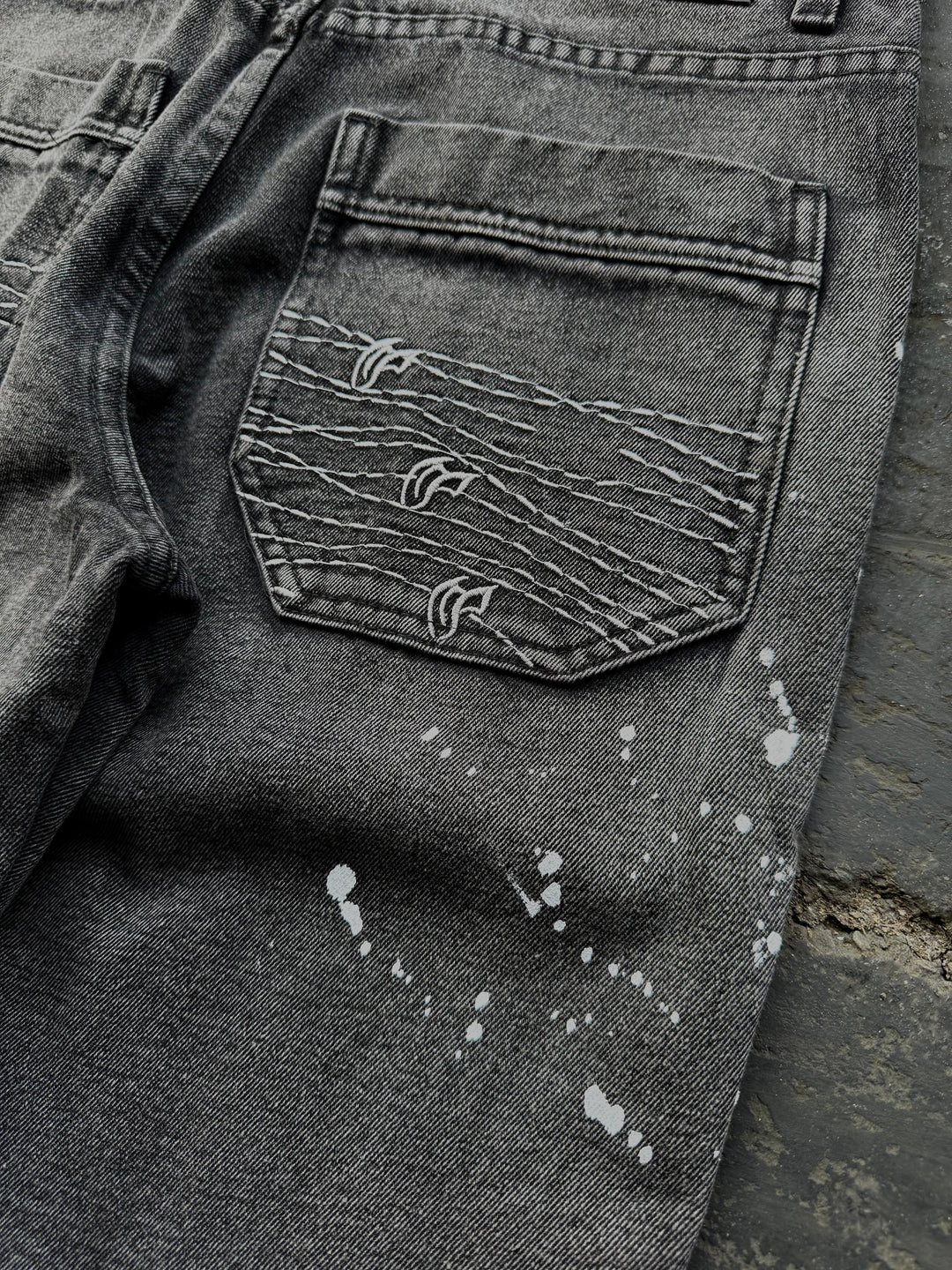 Dark washed wide leg jeans with dragon and floral embroidery