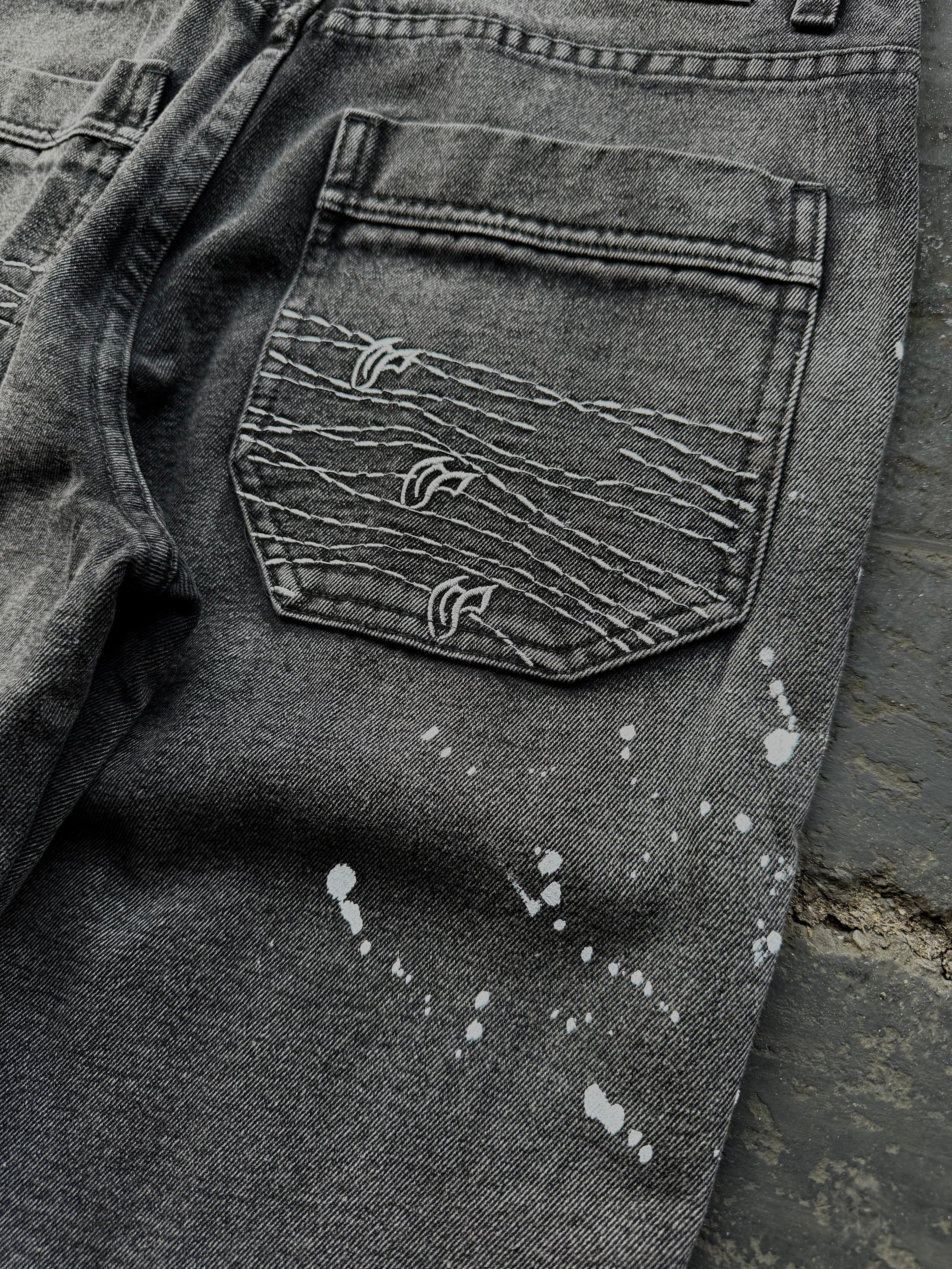 Dark washed wide leg jeans with dragon and floral embroidery