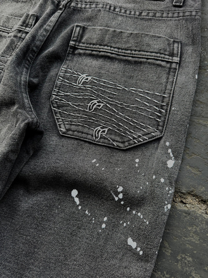 Dark washed wide leg jeans with dragon and floral embroidery