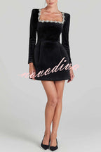 Women's velvet mini dress with embellished square neckline, long sleeves and flared skirt