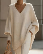 Women's oversized V-neck jumper with batwing sleeves and asymmetric hem