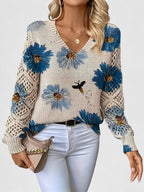 Women's floral V-neck sweater with long sleeves and open-knit sleeve panels