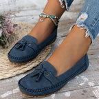 Women's flat moccasin loafers with decorative lacing and rounded toes