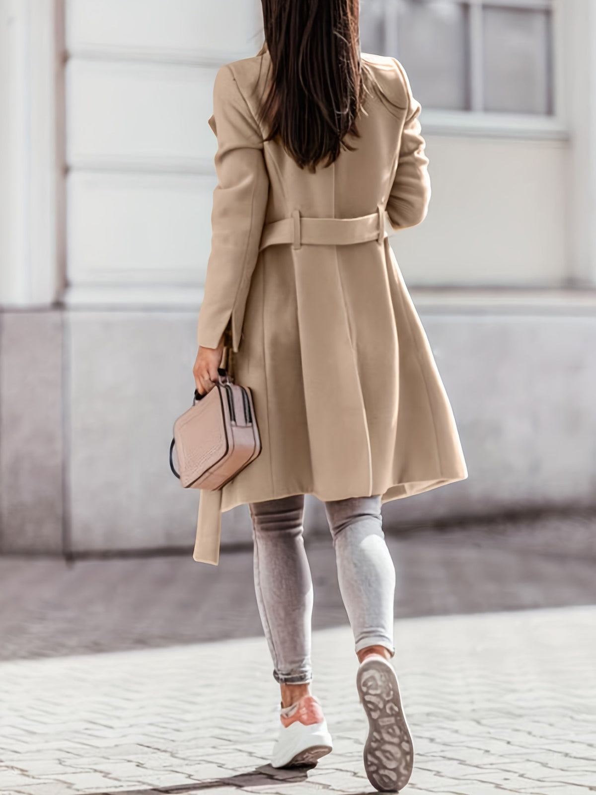 Women's beige long double-breasted trench coat with notched lapels