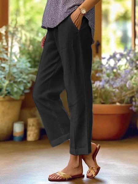 Women's cropped wide-leg trousers with side pockets and cuffed hems