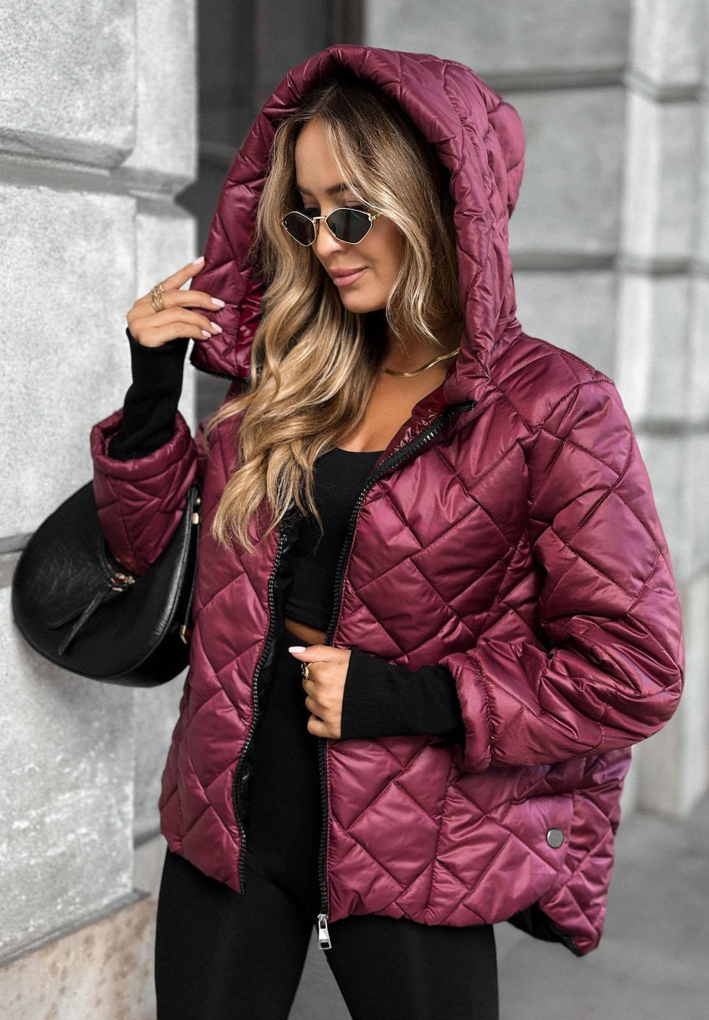 Women's quilted hooded jacket with diamond stitching and zip front