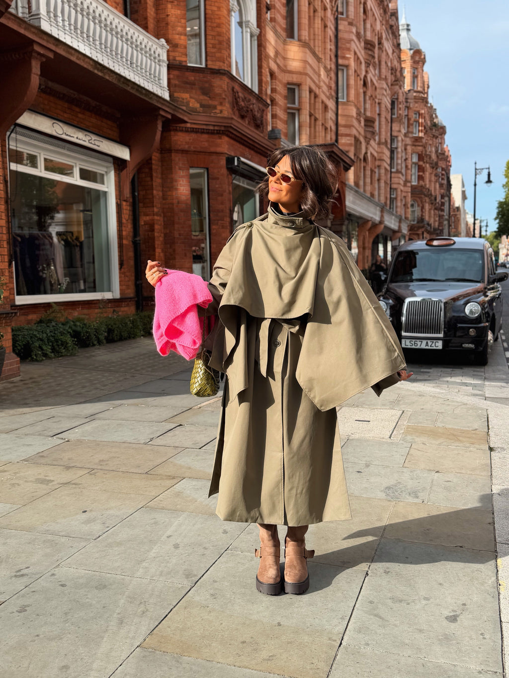 Women's beige belted trench coat with cape overlay and long sleeves