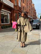 Women's beige belted trench coat with cape overlay and long sleeves