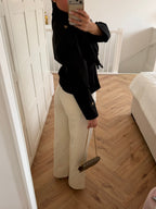 Women's black short trench coat with high collar, button front and tie belt