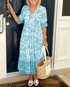 Women's floral V-neck midi dress with three-quarter sleeves