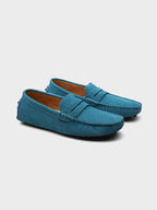 Men's suede boat loafers with rounded moc toe and penny strap detail