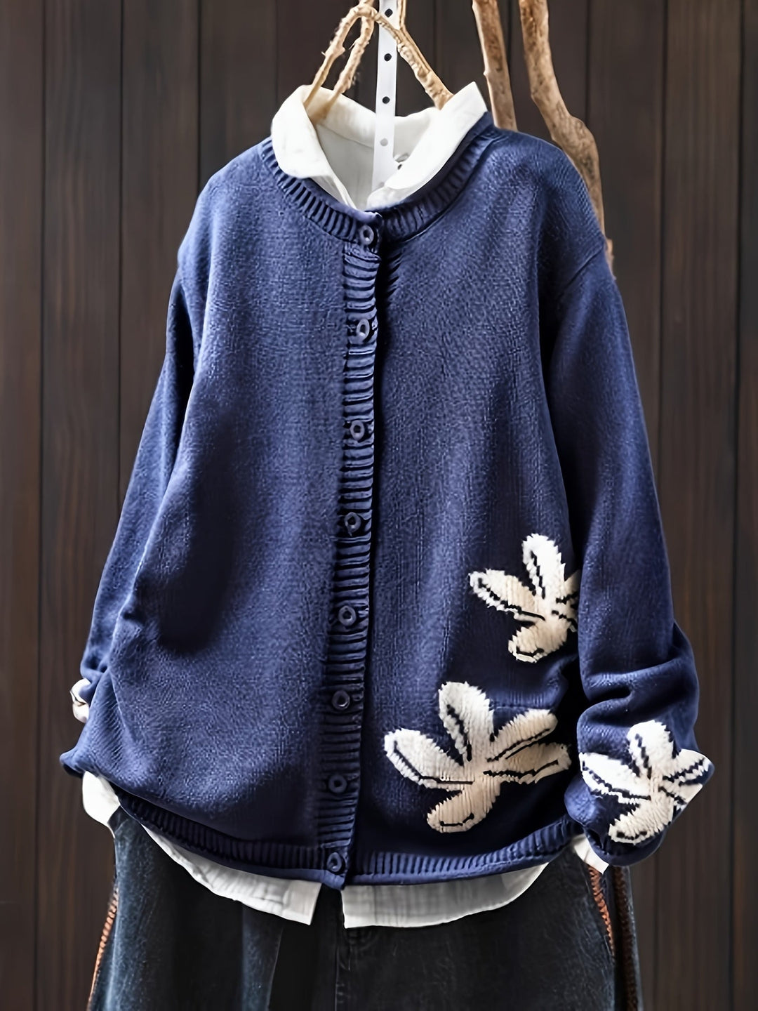 Women's navy floral knit cardigan with button front and long sleeves