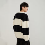 Men's black and cream striped polo sweater with long sleeves and button placket