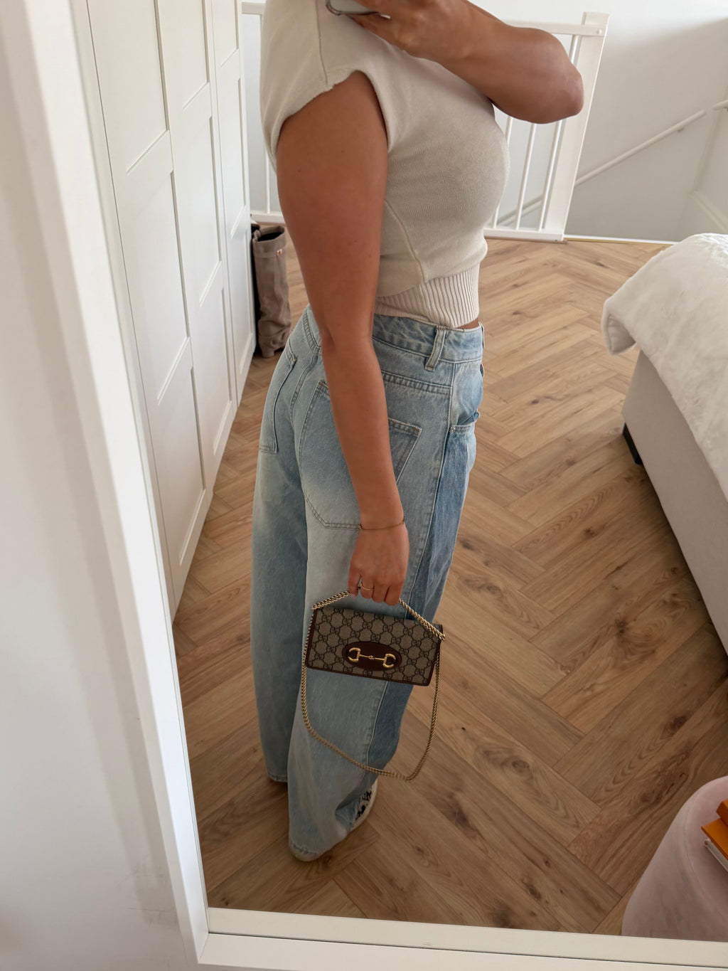Women's light blue high-rise wide leg jeans with front pockets and full-length hems